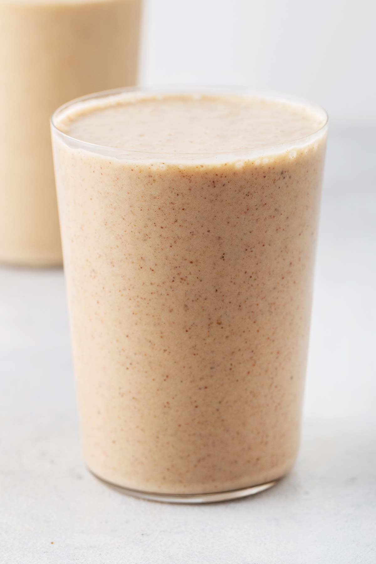 Almond milk smoothie in a cup.
