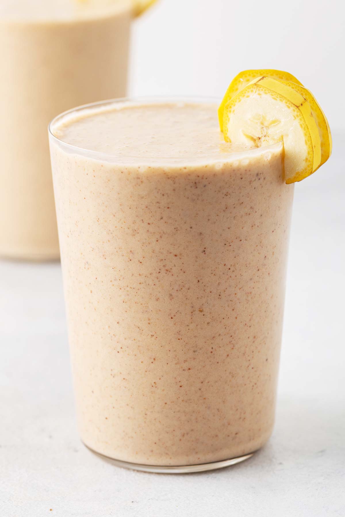 Almond milk smoothie in a glass.
