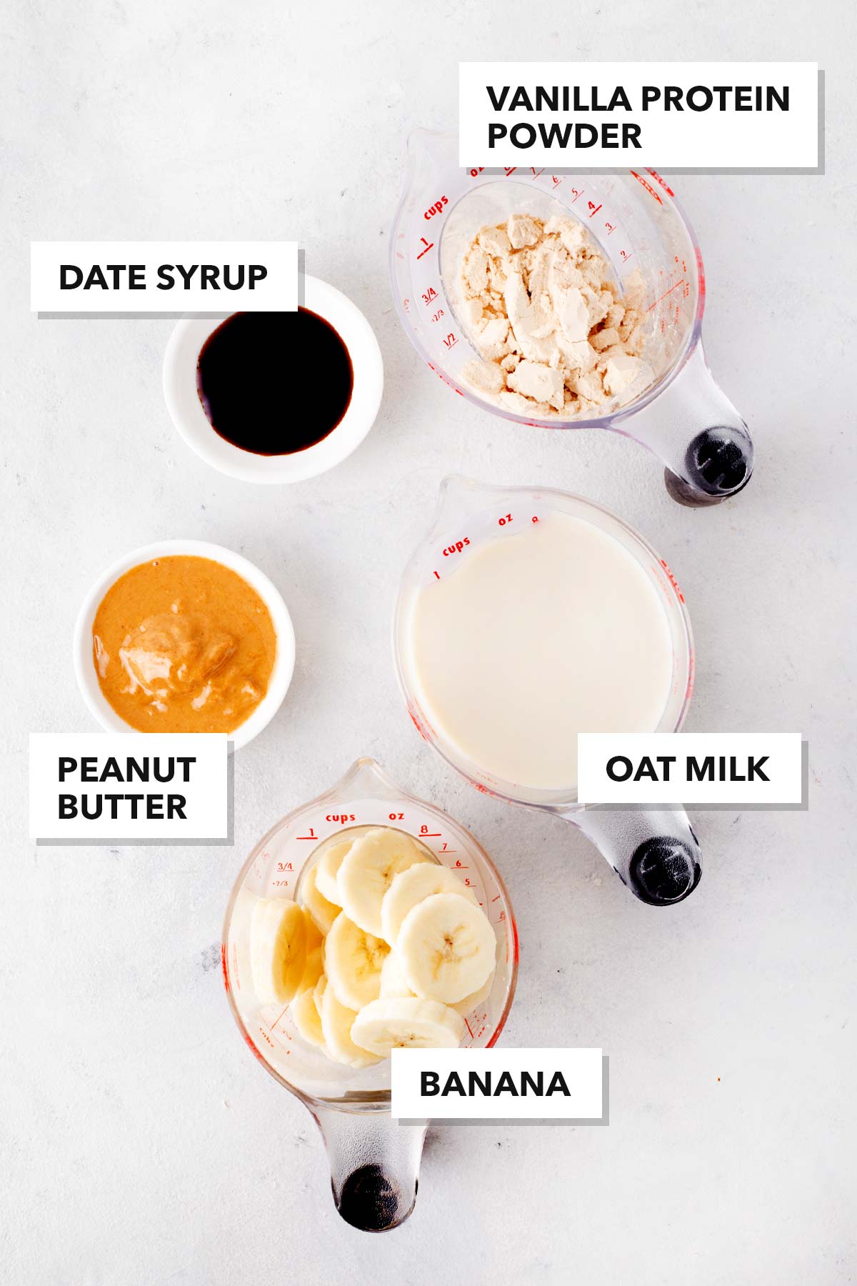 Ingredients for a peanut butter banana protein shake.