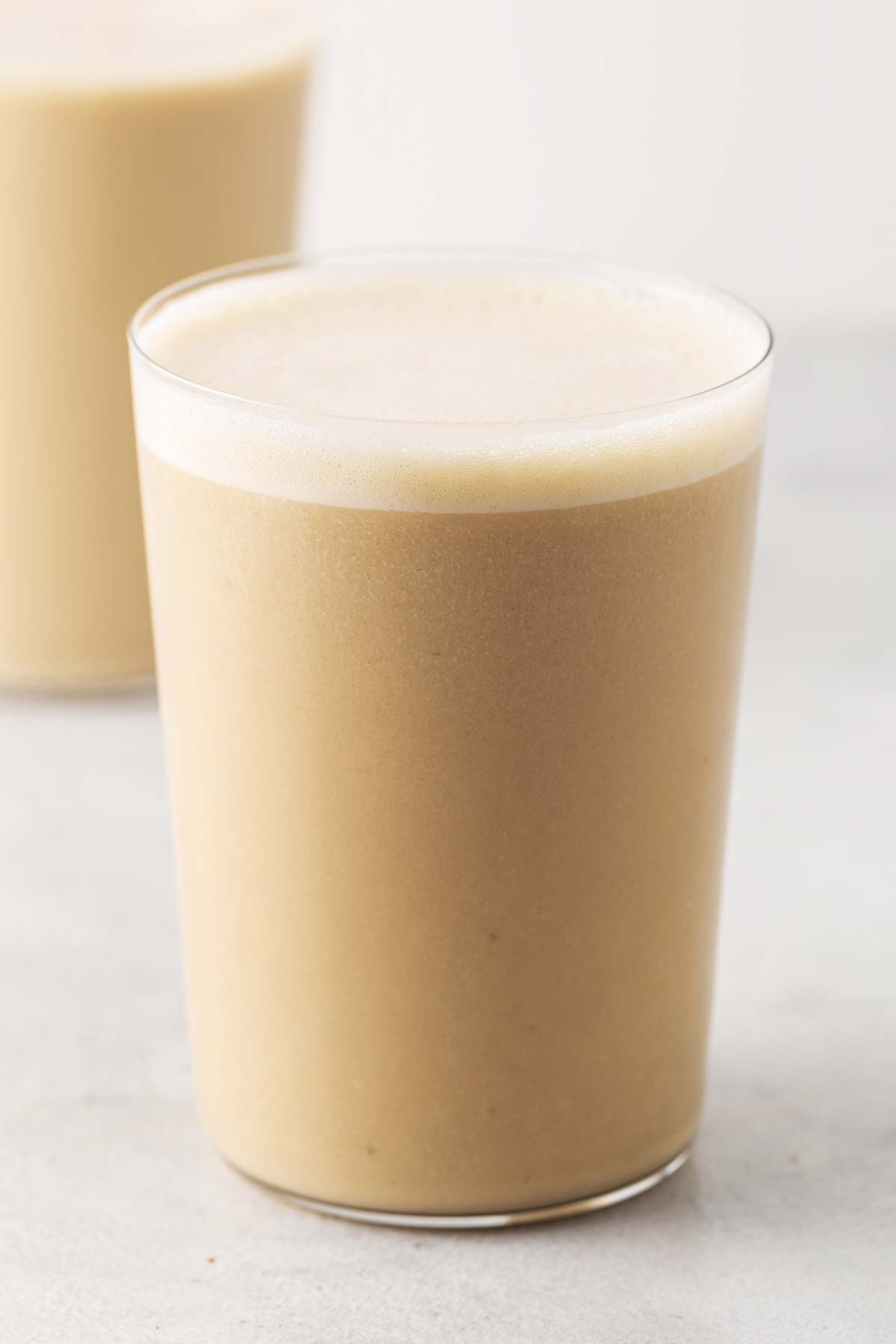 Banana protein shake in a cup.