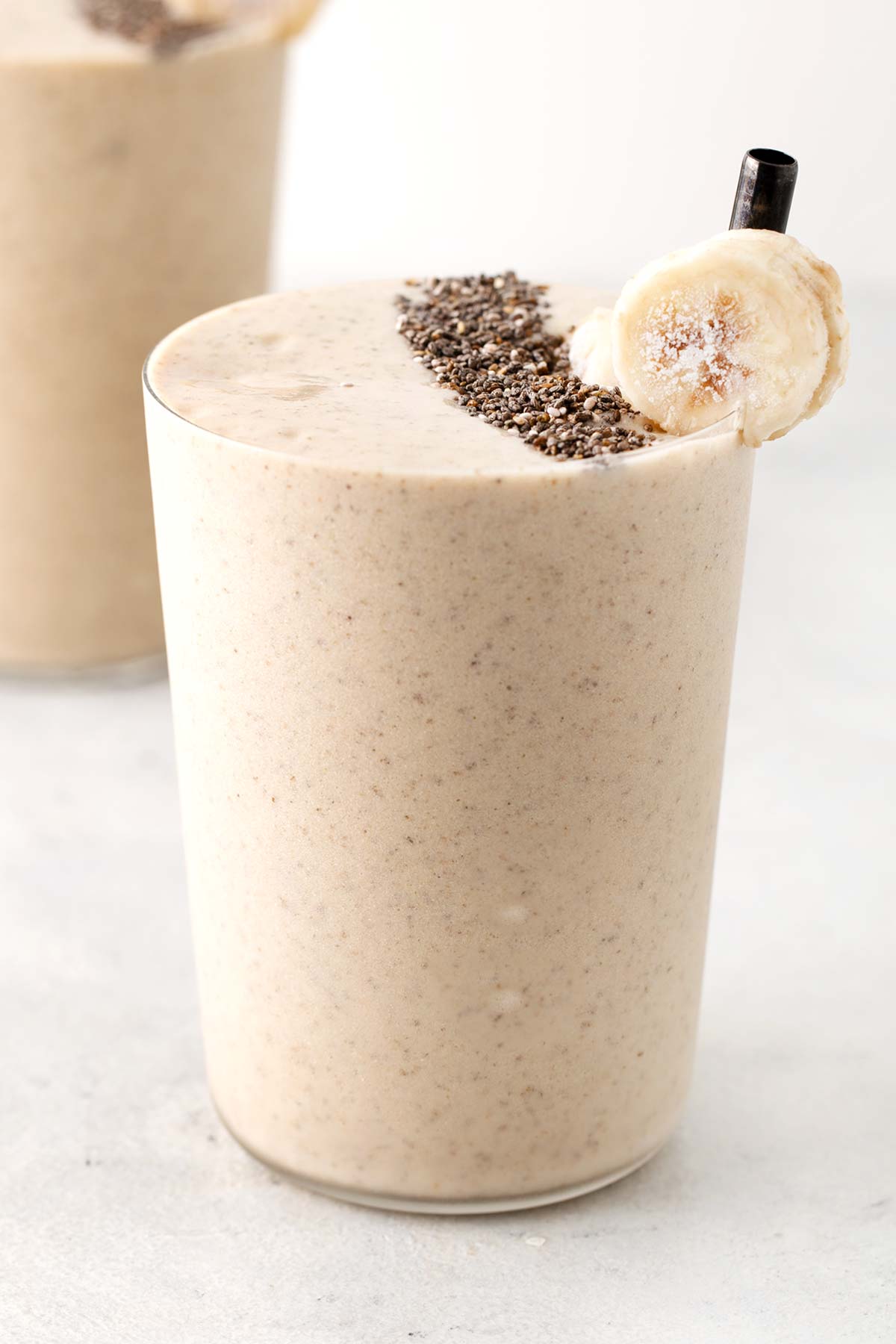 Banana protein smoothie in a glass.