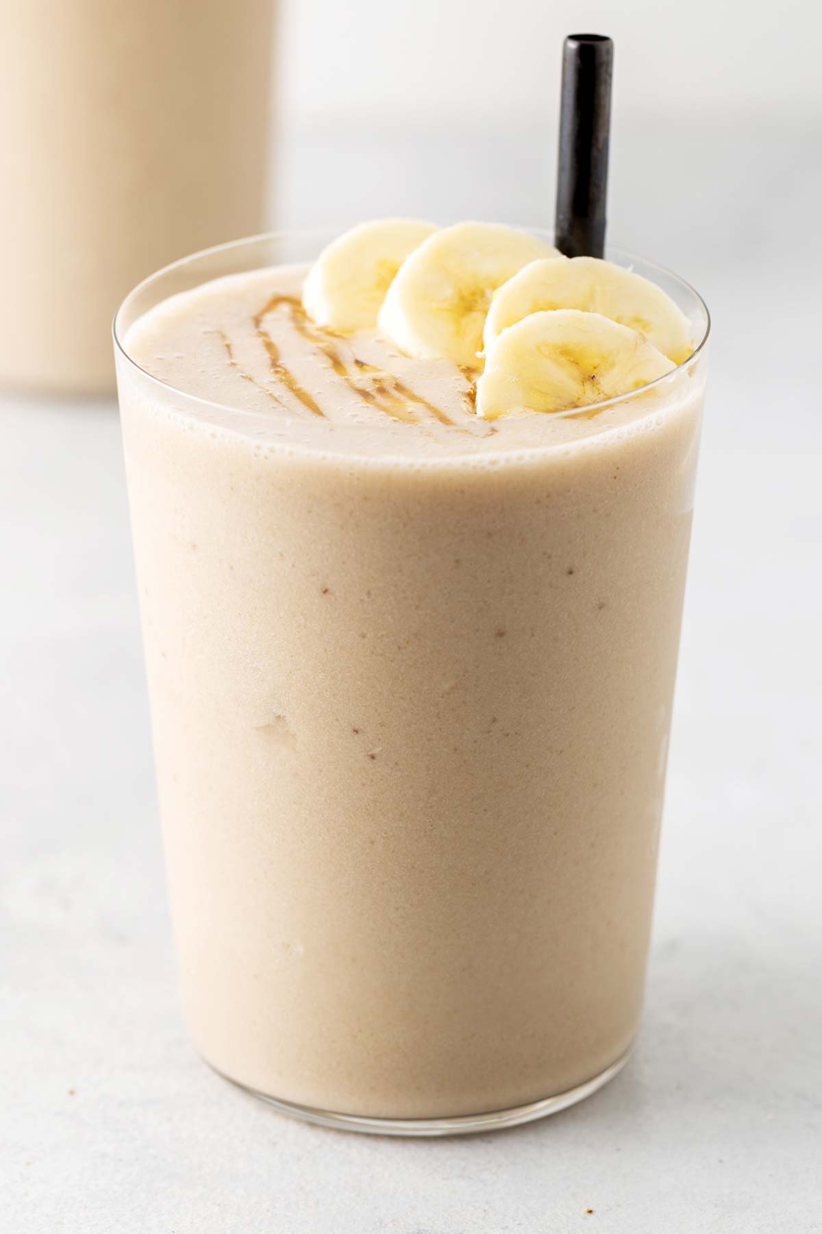 Banana smoothie in a glass.