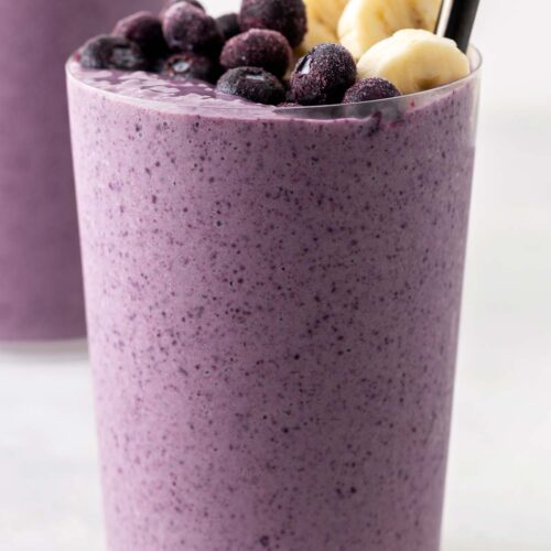 Blueberry banana smoothie in a glass.