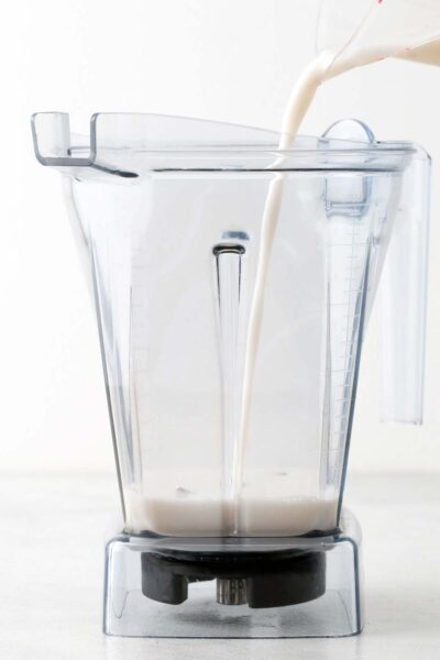 Almond milk poured into a blender. 