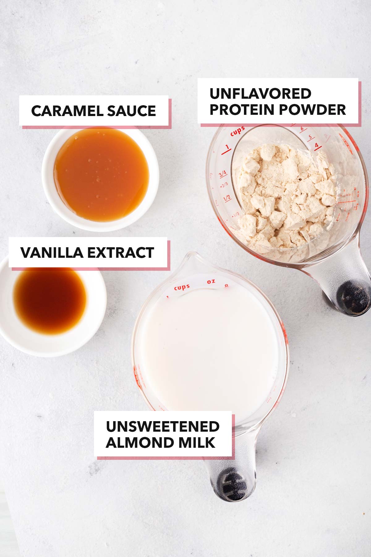 Ingredients for a caramel protein shake on a gray table.