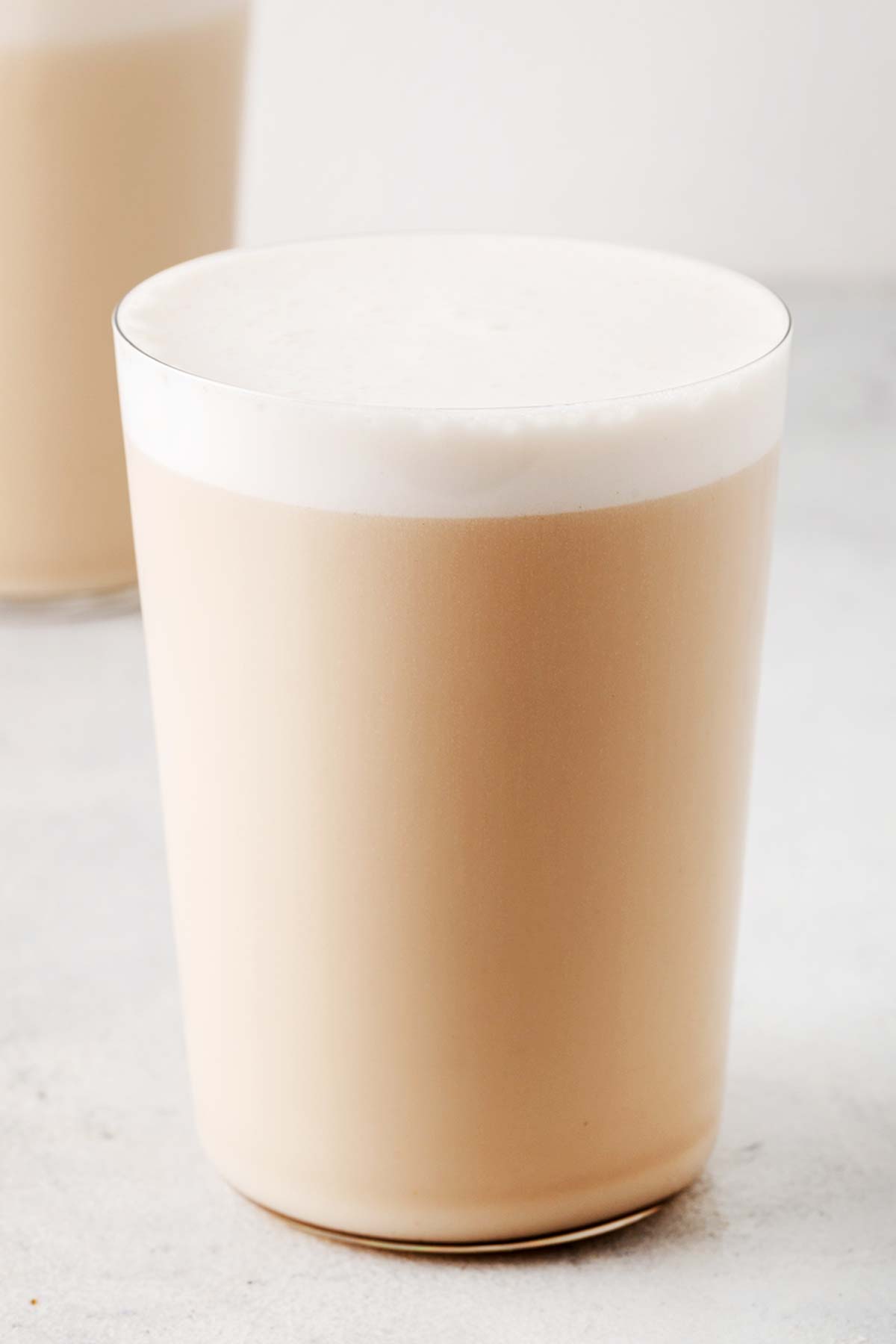 Caramel protein shake in a glass.