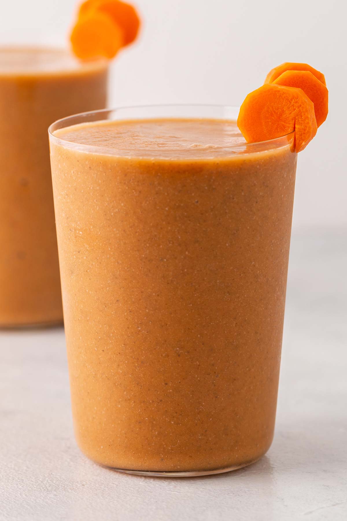 Carrot smoothie in a glass.