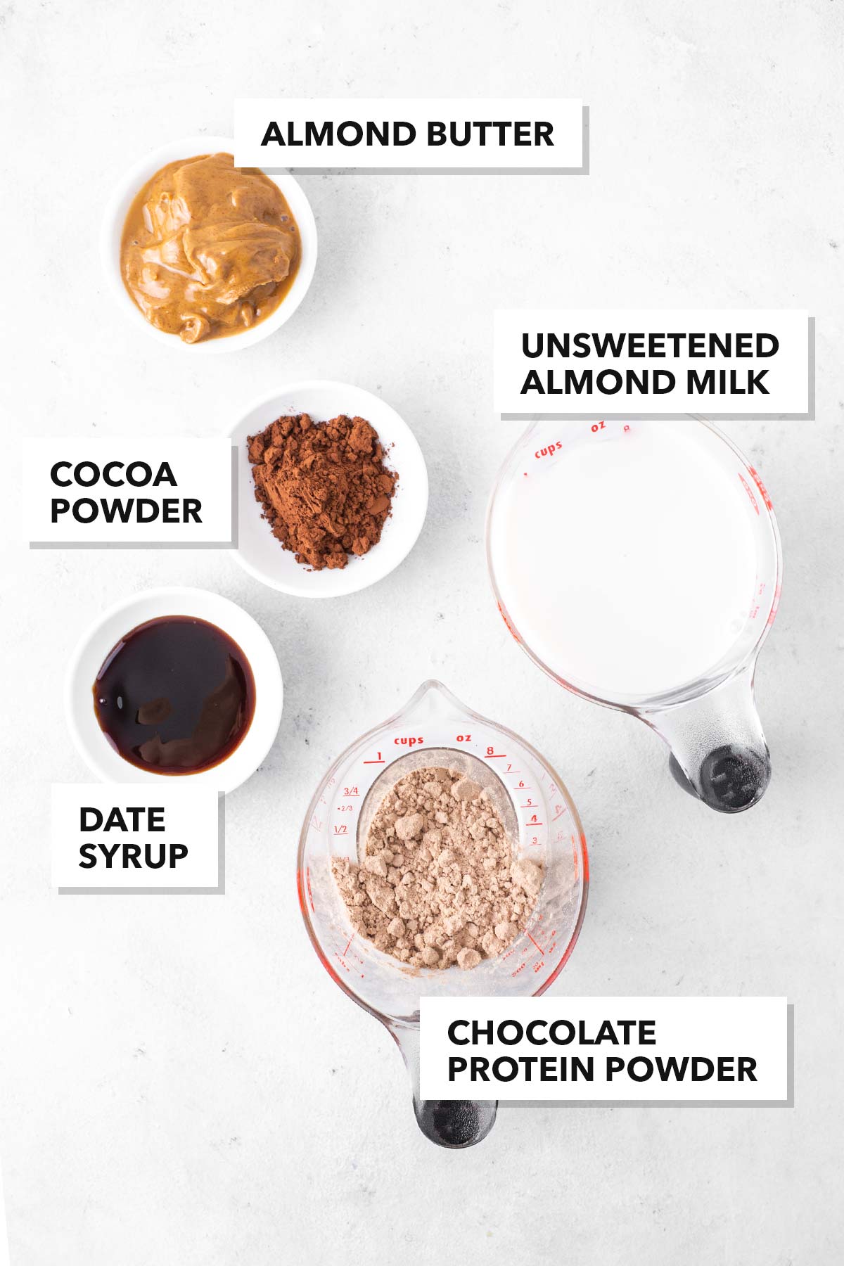 Ingredients for a chocolate almond protein shake.