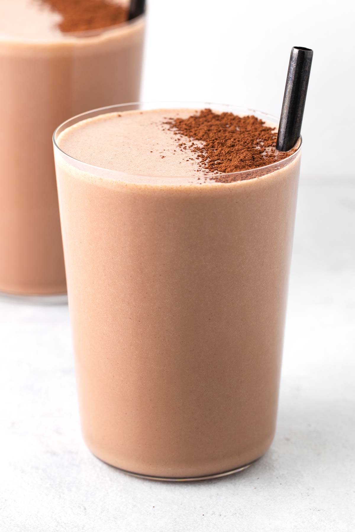 Chocolate almond protein shake in a glass.