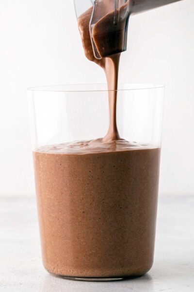 Chocolate smoothie poured into a cup. 