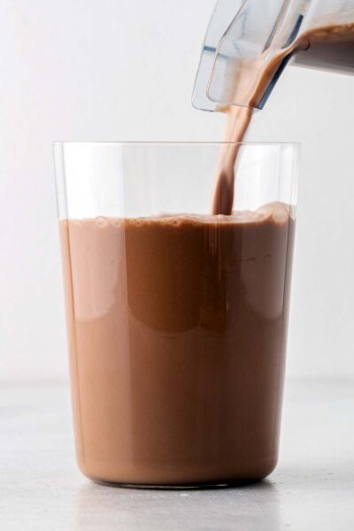 Chocolate protein shake poured into a cup. 