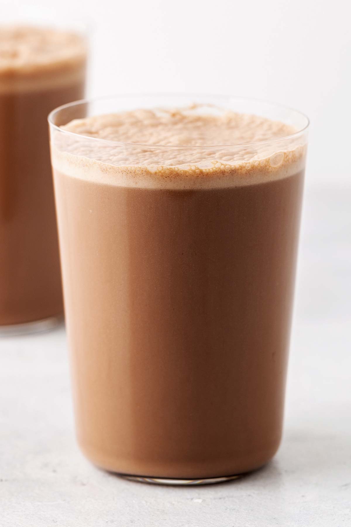 Chocolate protein shake in a glass.