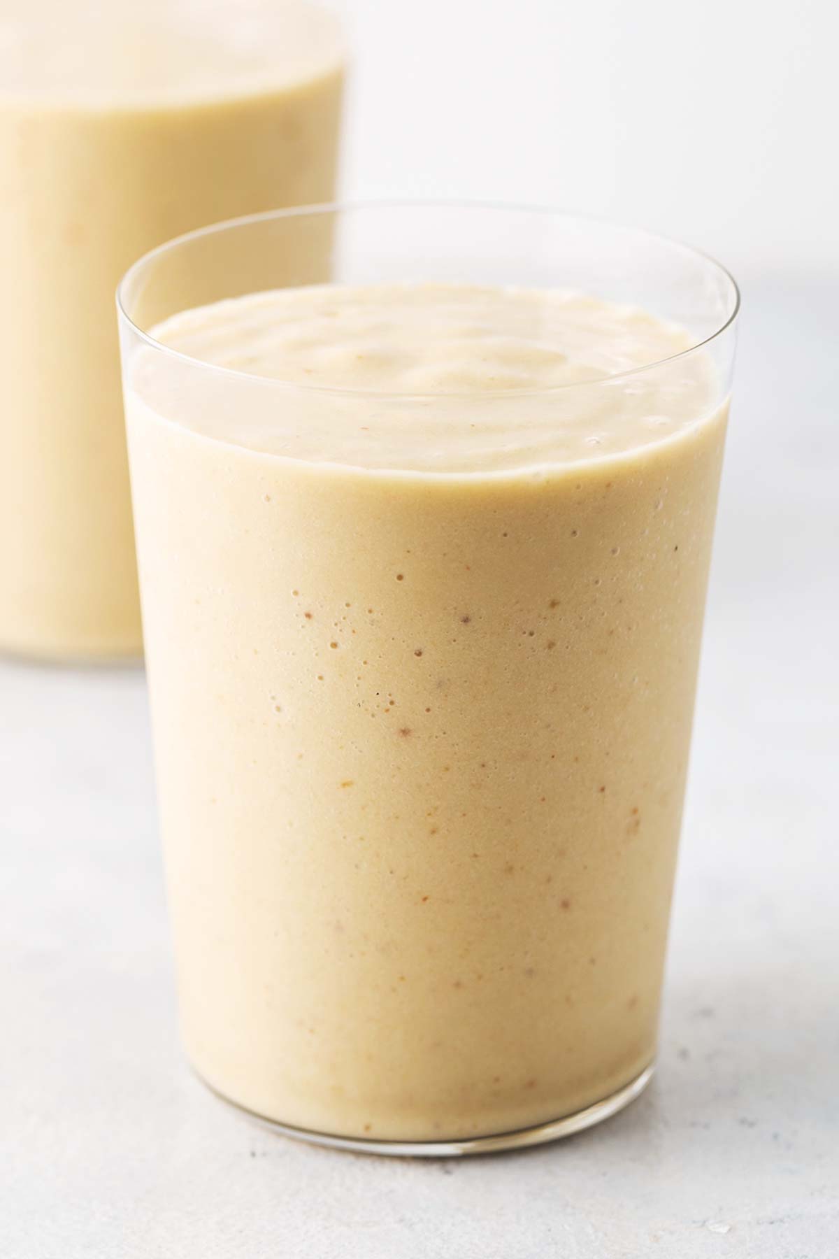 Coconut milk smoothie in a glass.