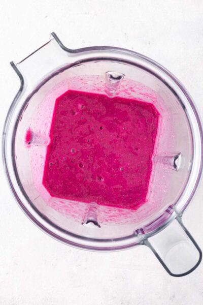 Pink dragon fruit smoothie in a blender. 