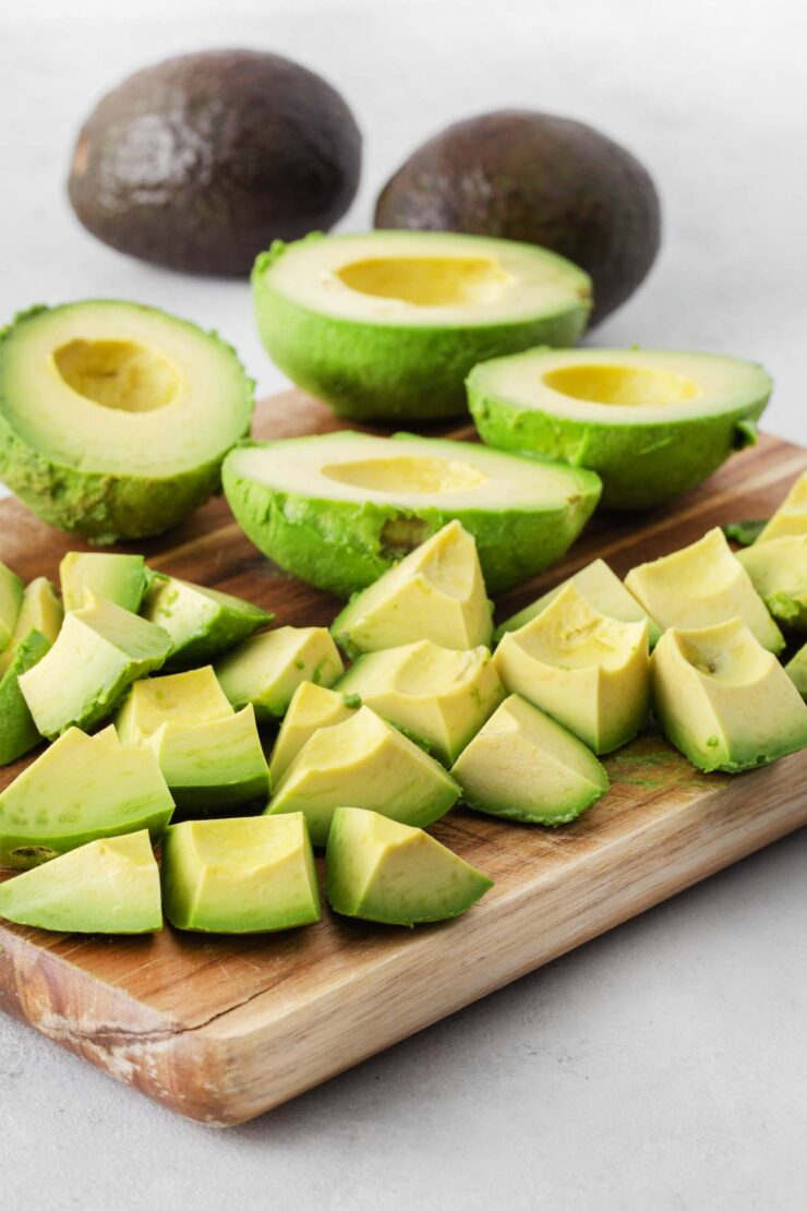 Avocados cut in half and into small pieces.