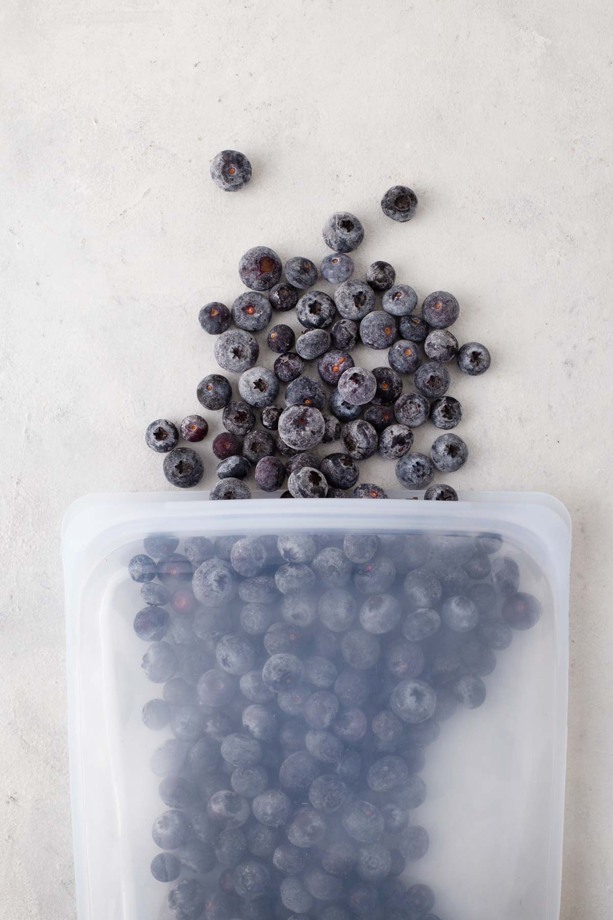 Frozen blueberries in a silicone bag.