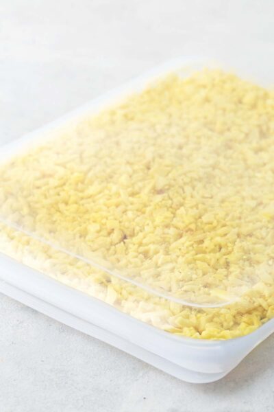 Minced ginger in a silicone freezer bag.