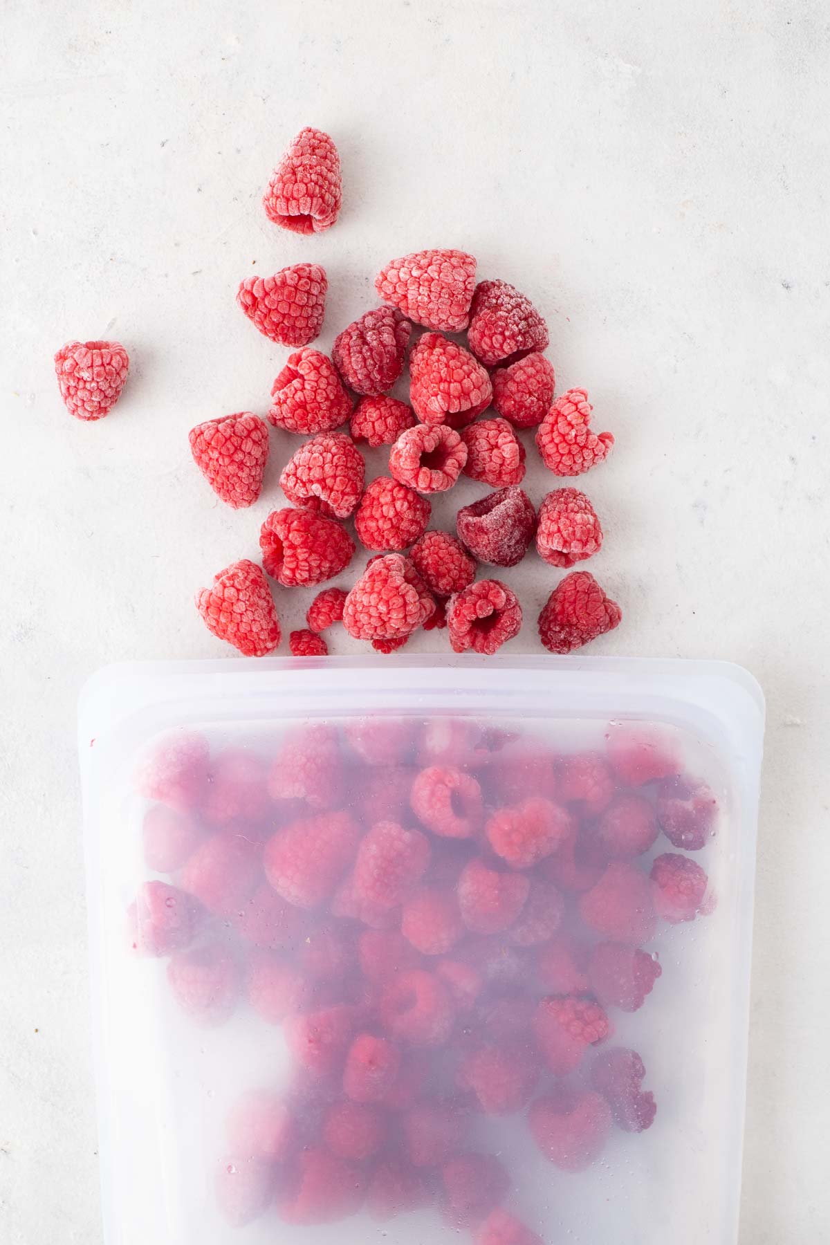 Frozen raspberries in a silicone bag.