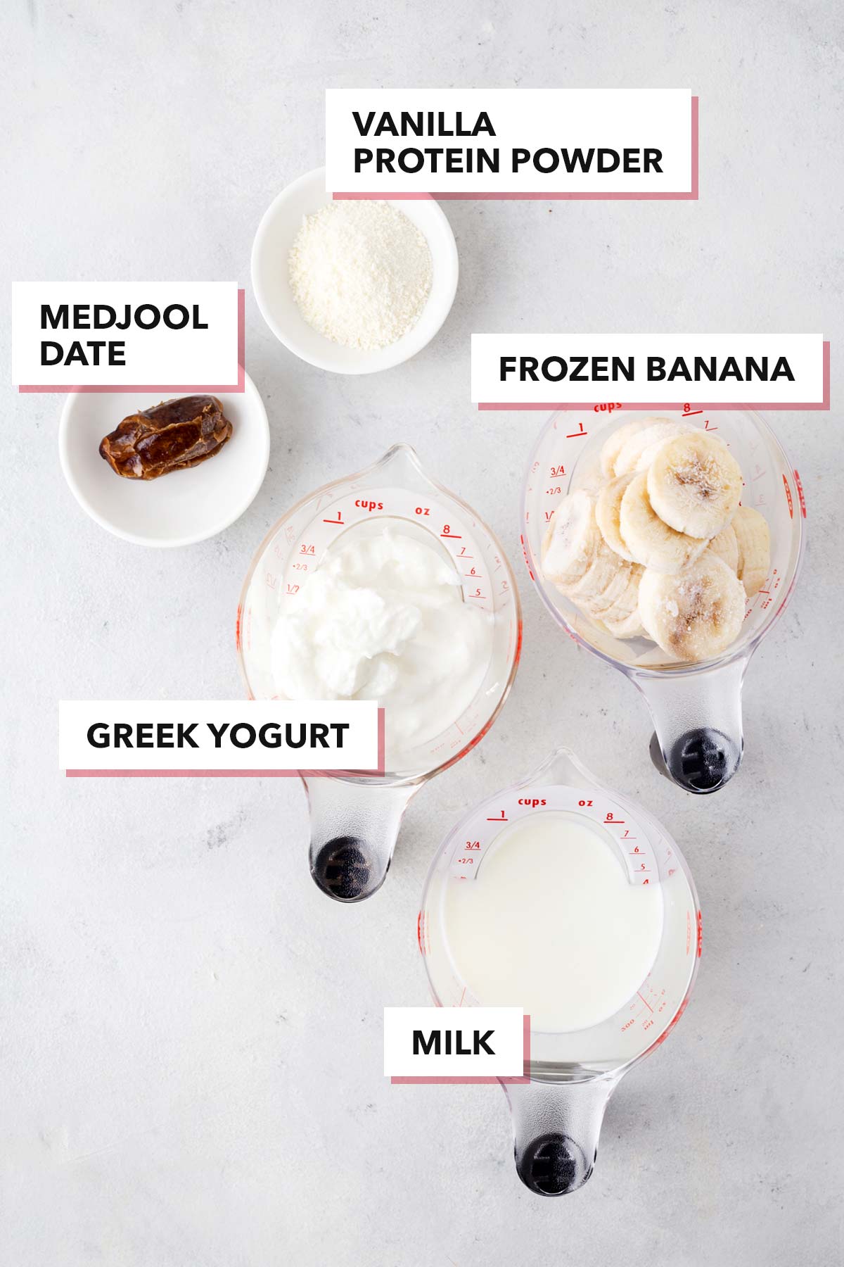 Ingredients for Greek yogurt smoothie on a table.