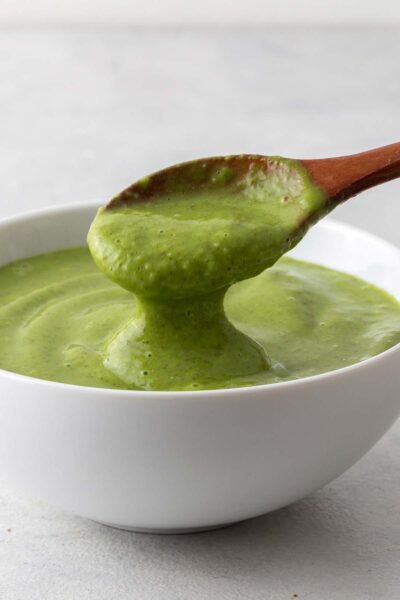Green smoothie spooned into a bowl.