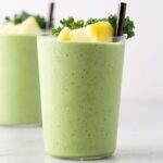 Kale pineapple smoothie in a cup.