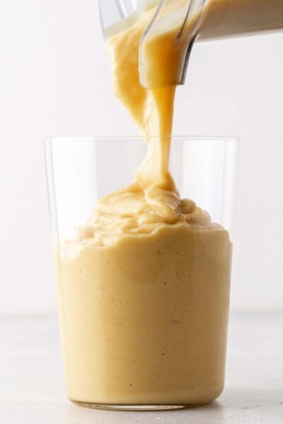 Mango smoothie poured into a cup. 