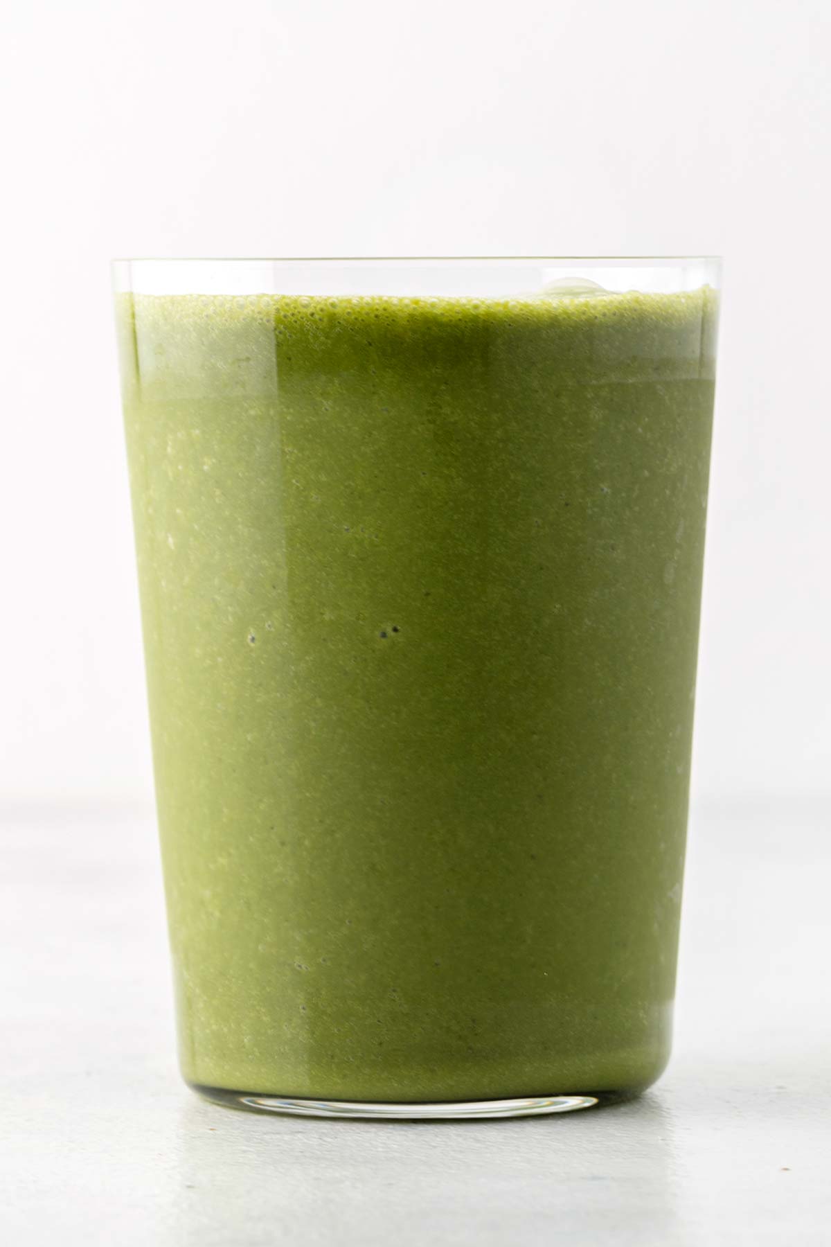 Matcha smoothie in a glass.