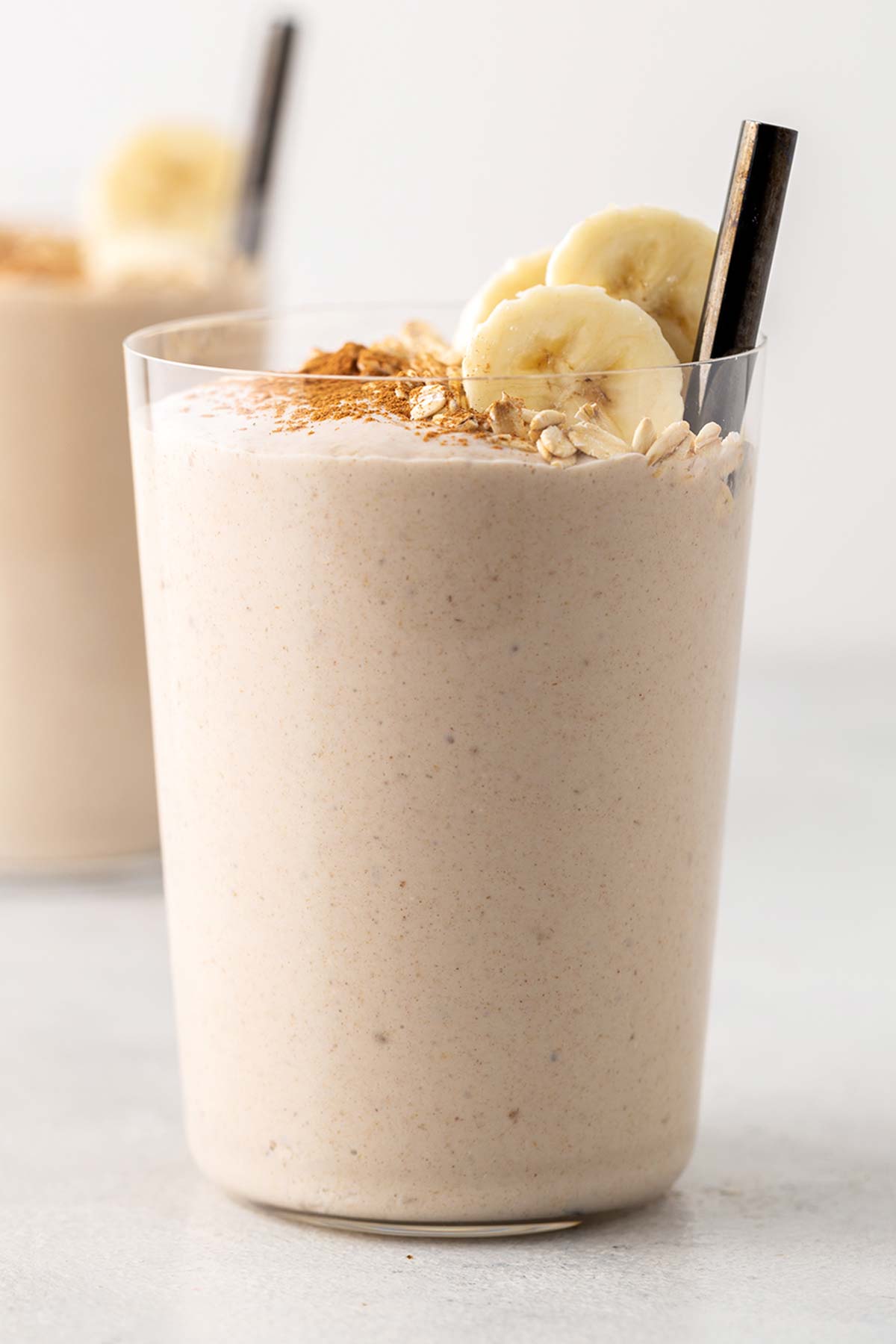 Oatmeal smoothie in a glass cup.