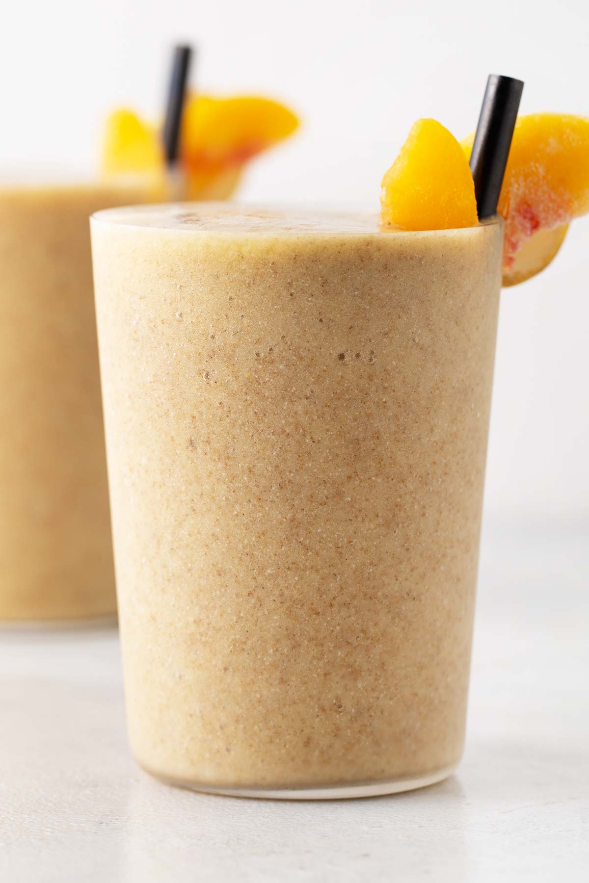 Peach smoothie in a glass.