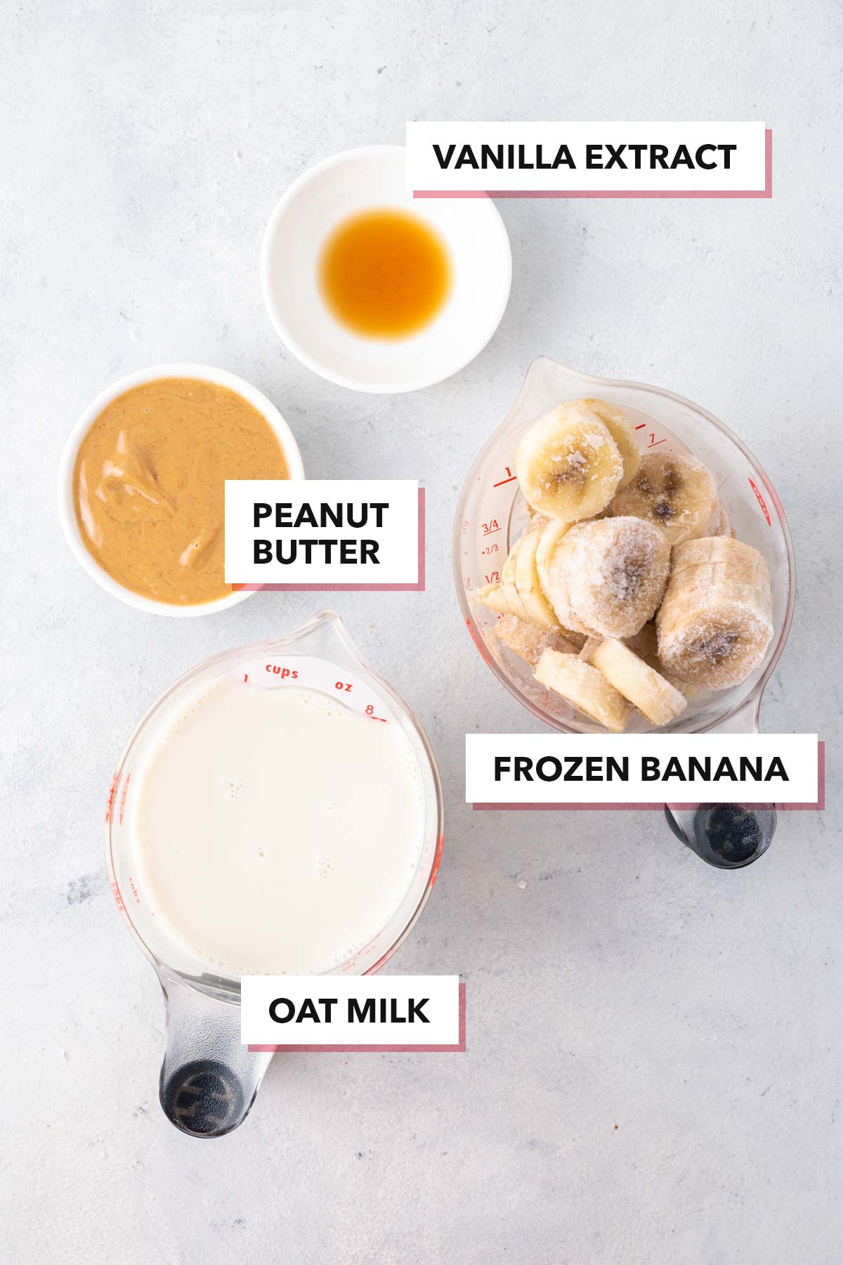 Ingredients for peanut butter banana smoothie on a table.