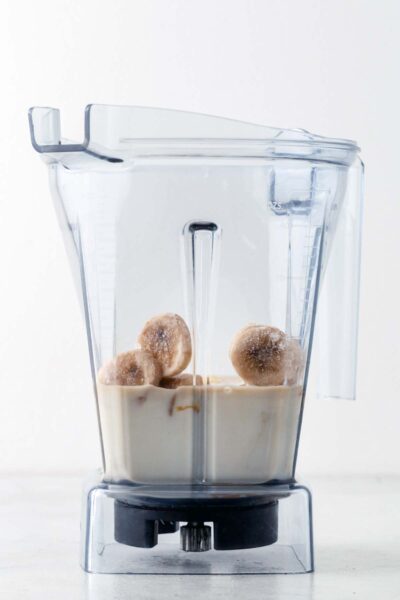 Milk and frozen bananas in a blender.