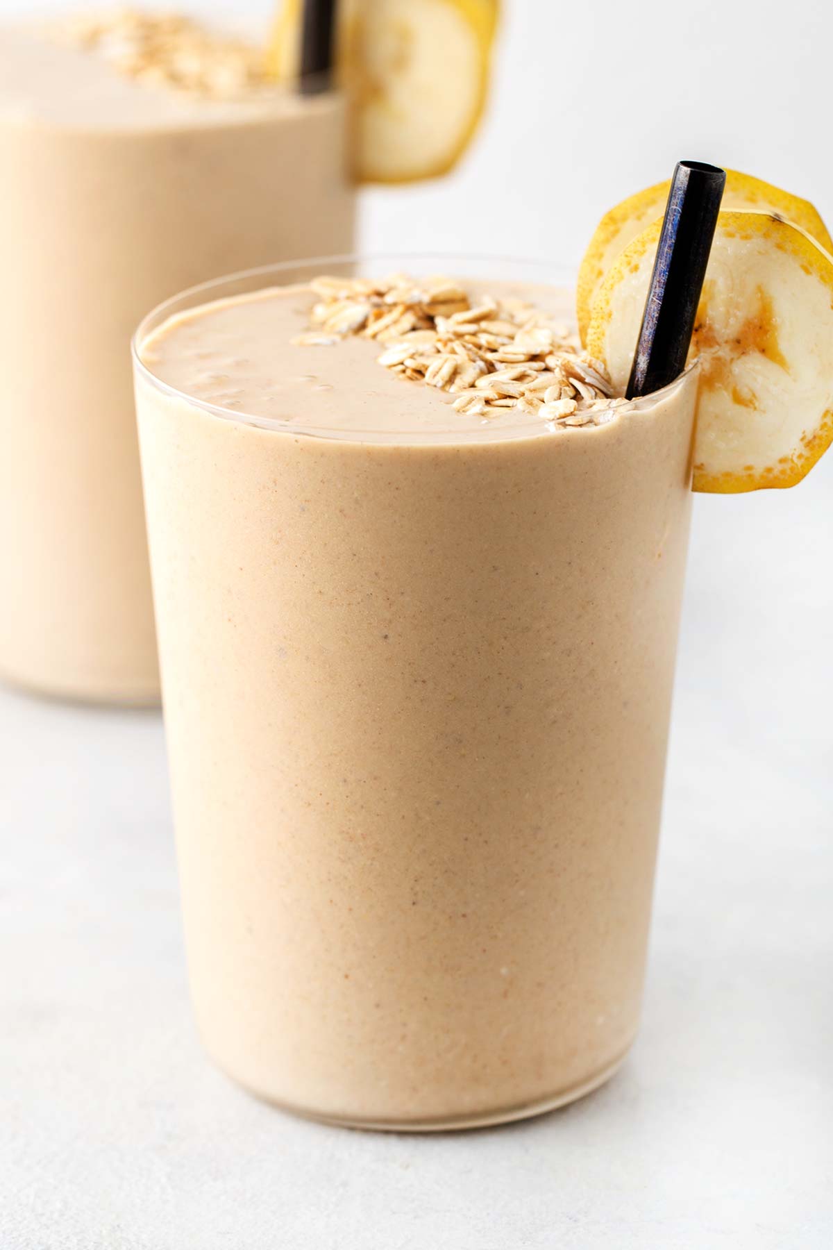 Peanut butter oatmeal smoothie in a glass.