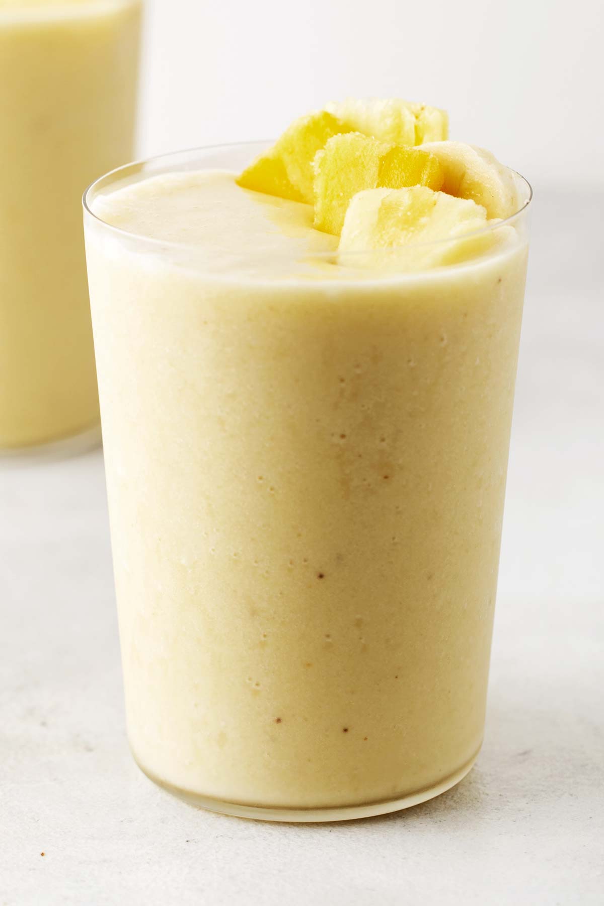 Pina colada smoothie in a glass.