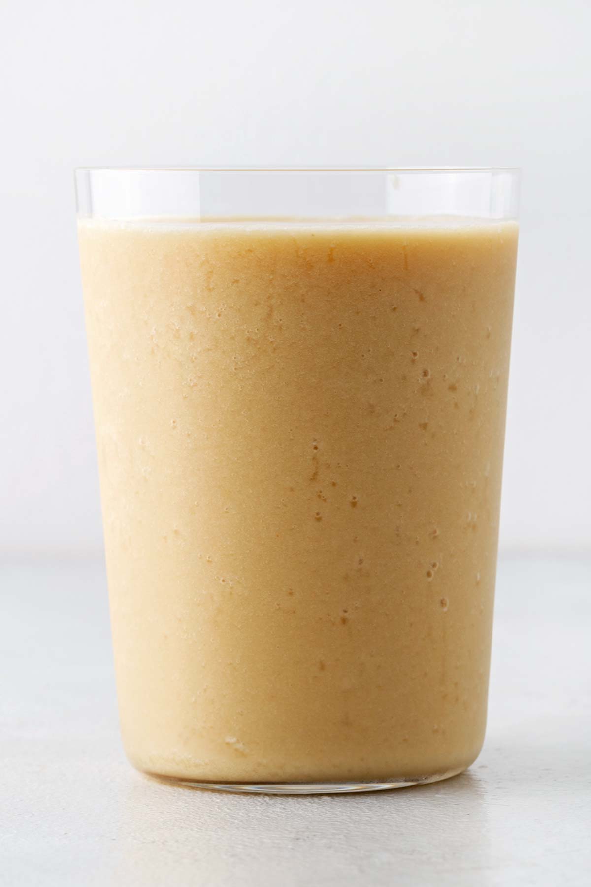 Pineapple Ginger smoothie in a glass.