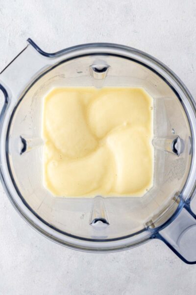 Pineapple smoothie blended in a blender cup. 