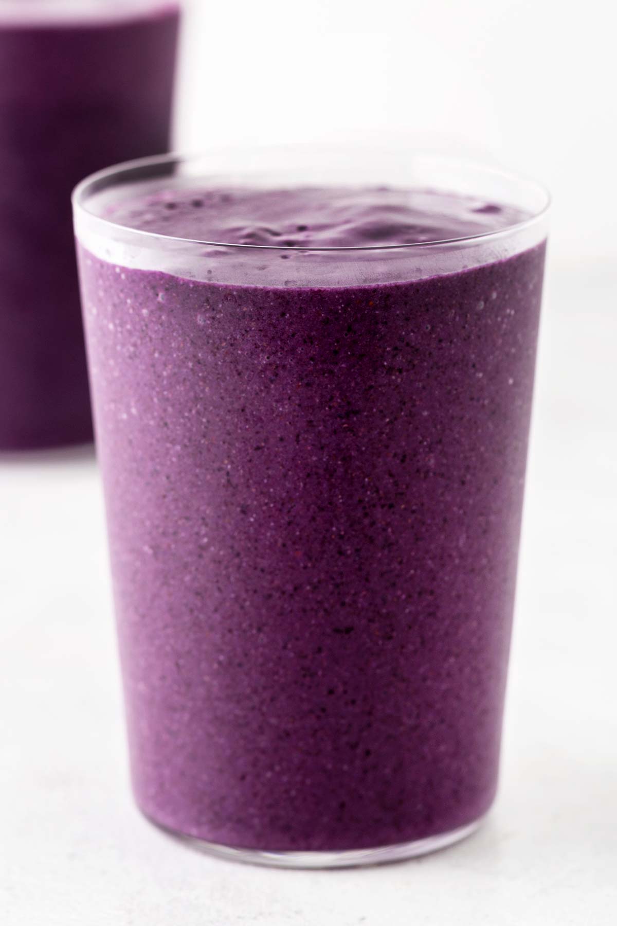 Purple sweet potato smoothie in a glass.