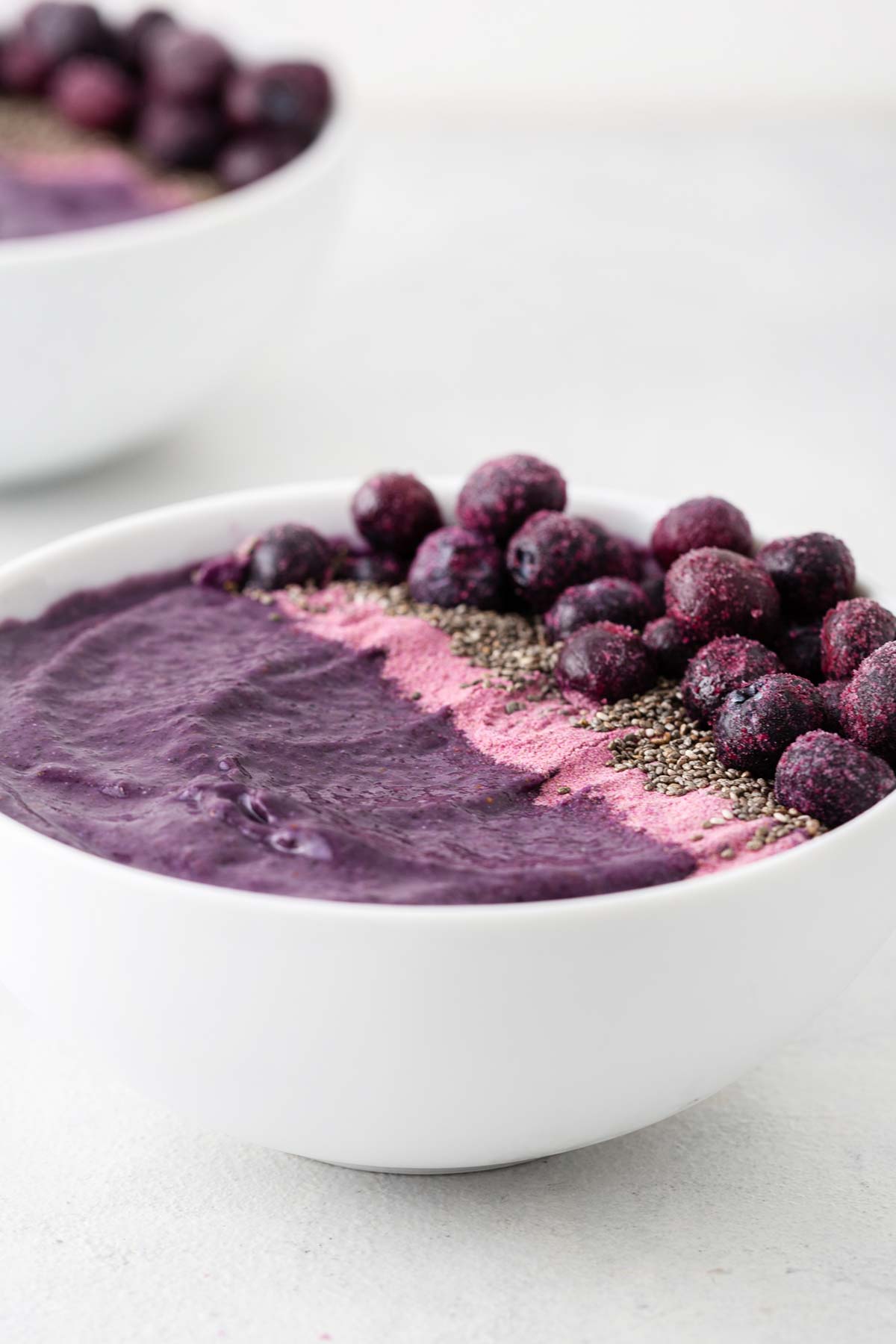 Purple Sweet Potato Smoothie Bowls on a tabletop.