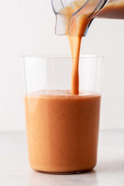 Raspberry Mango smoothie poured in a cup. 