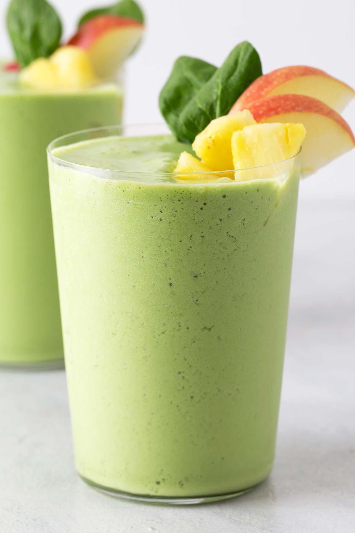 Spinach smoothie in a cup.