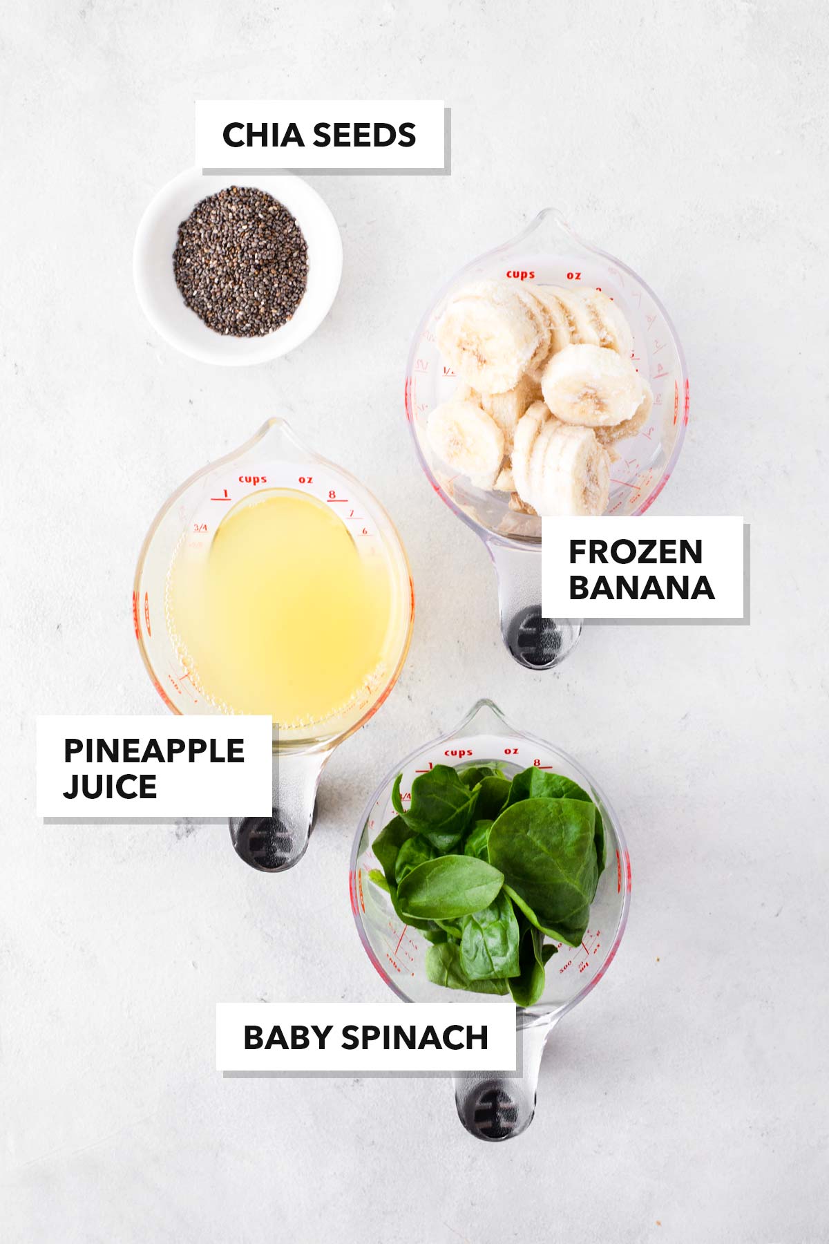 Ingredients for a spinach smoothie in a blender.