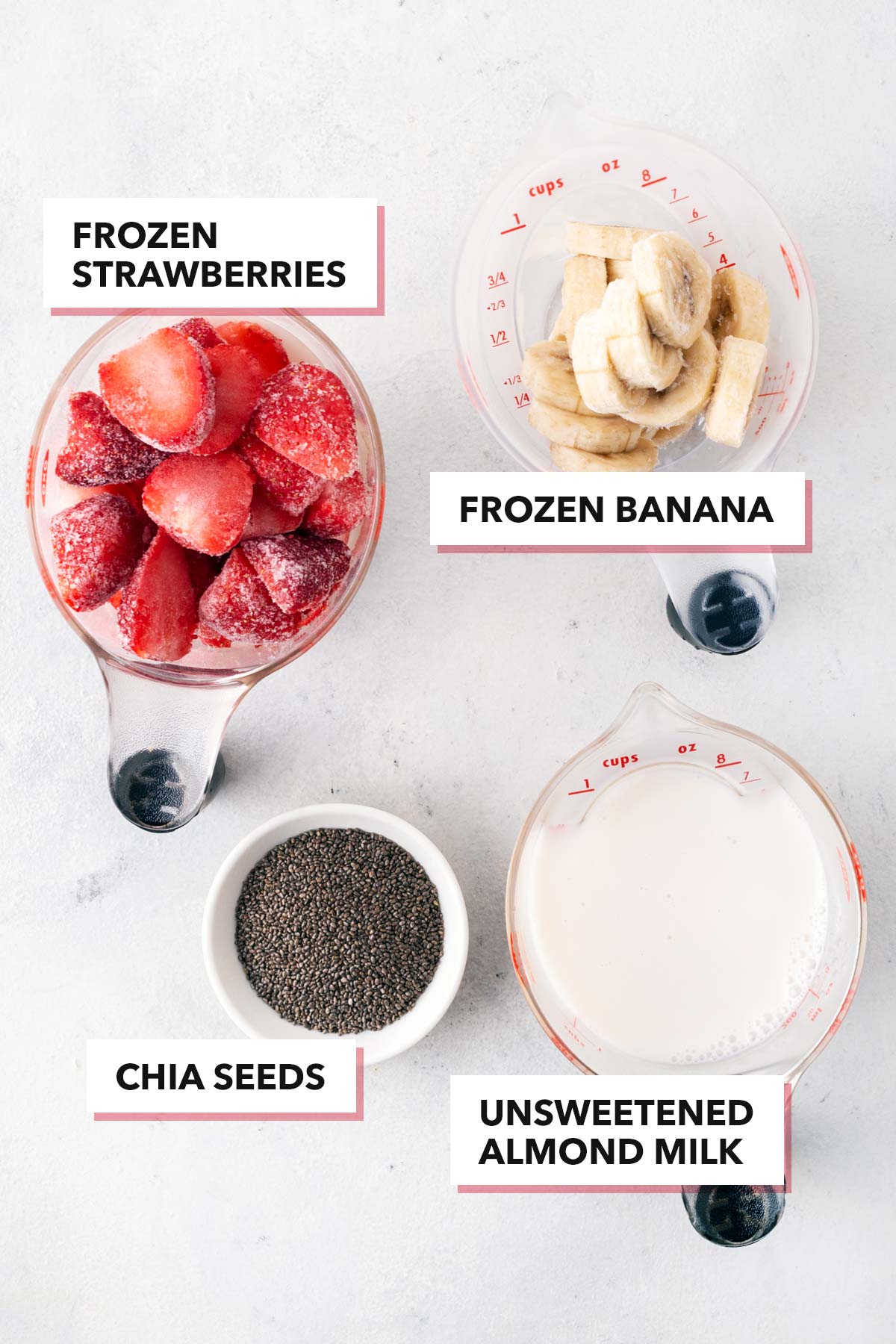 Ingredients for a strawberry banana smoothie bowl.