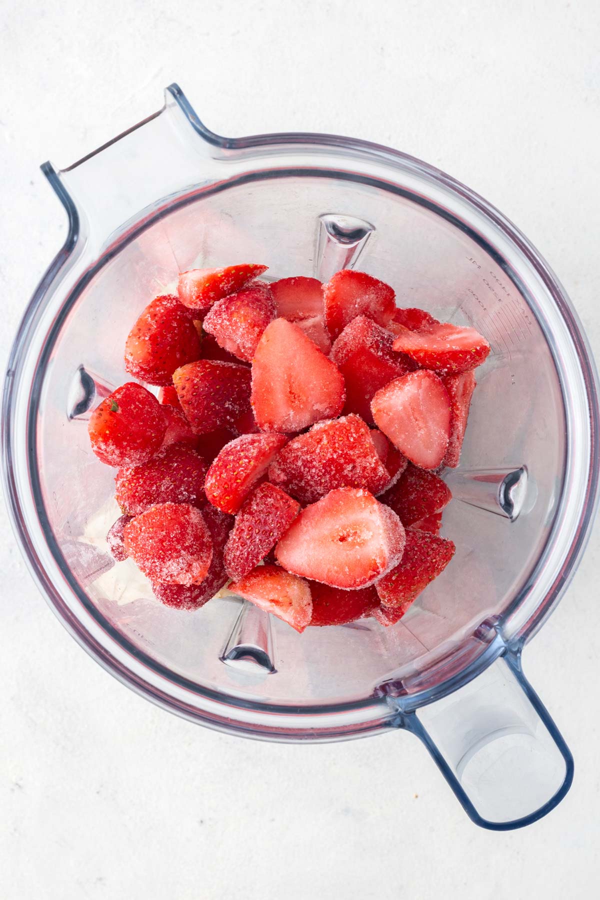 Strawberry Banana Smoothie Bowl ingredients in a blender.