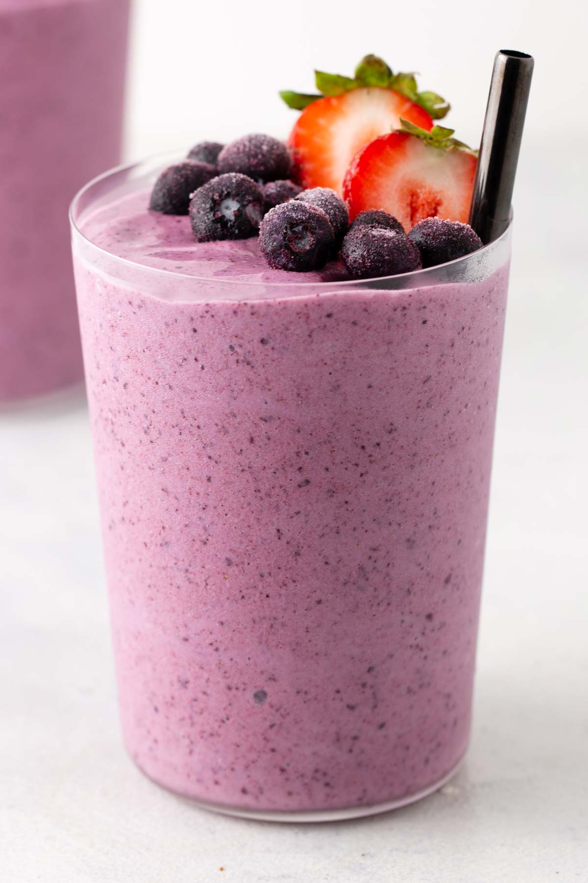 Strawberry blueberry smoothie in a glass.