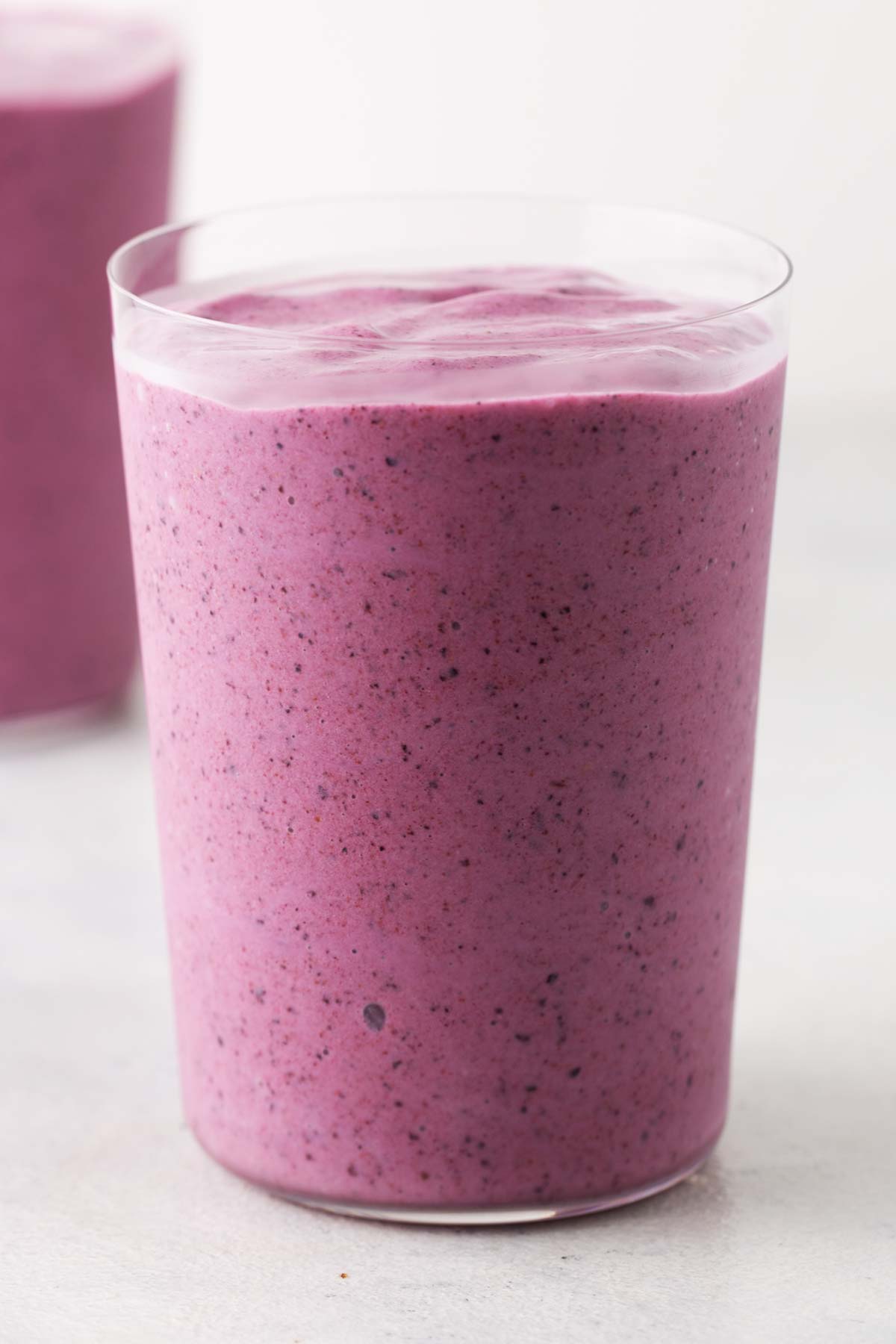 Strawberry blueberry smoothie in a glass.