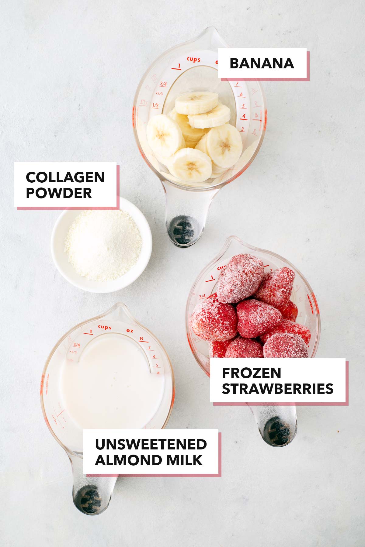 Ingredients for strawberry collagen smoothie on a table.