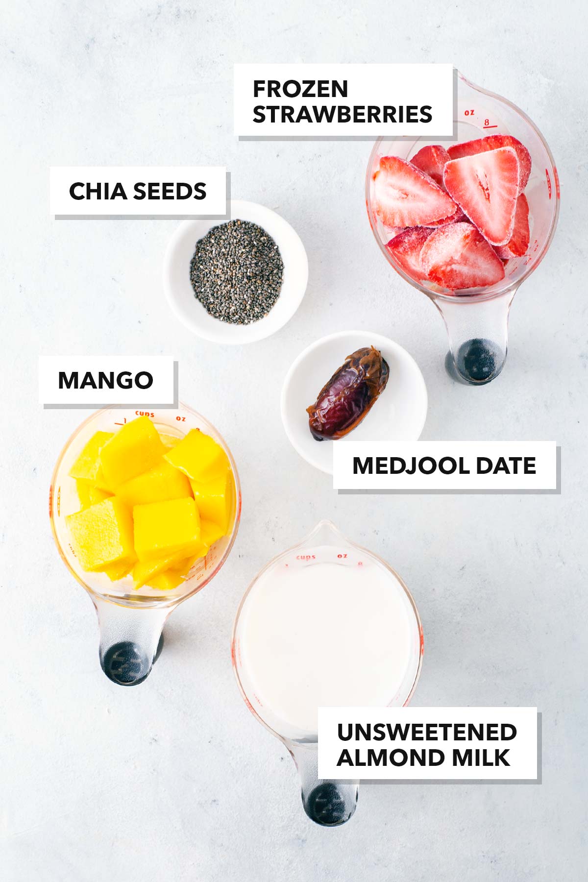 Ingredients for a strawberry mango smoothie.
