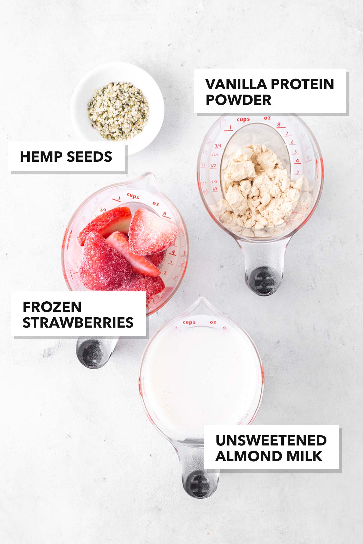 Ingredients for a strawberry protein smoothie.