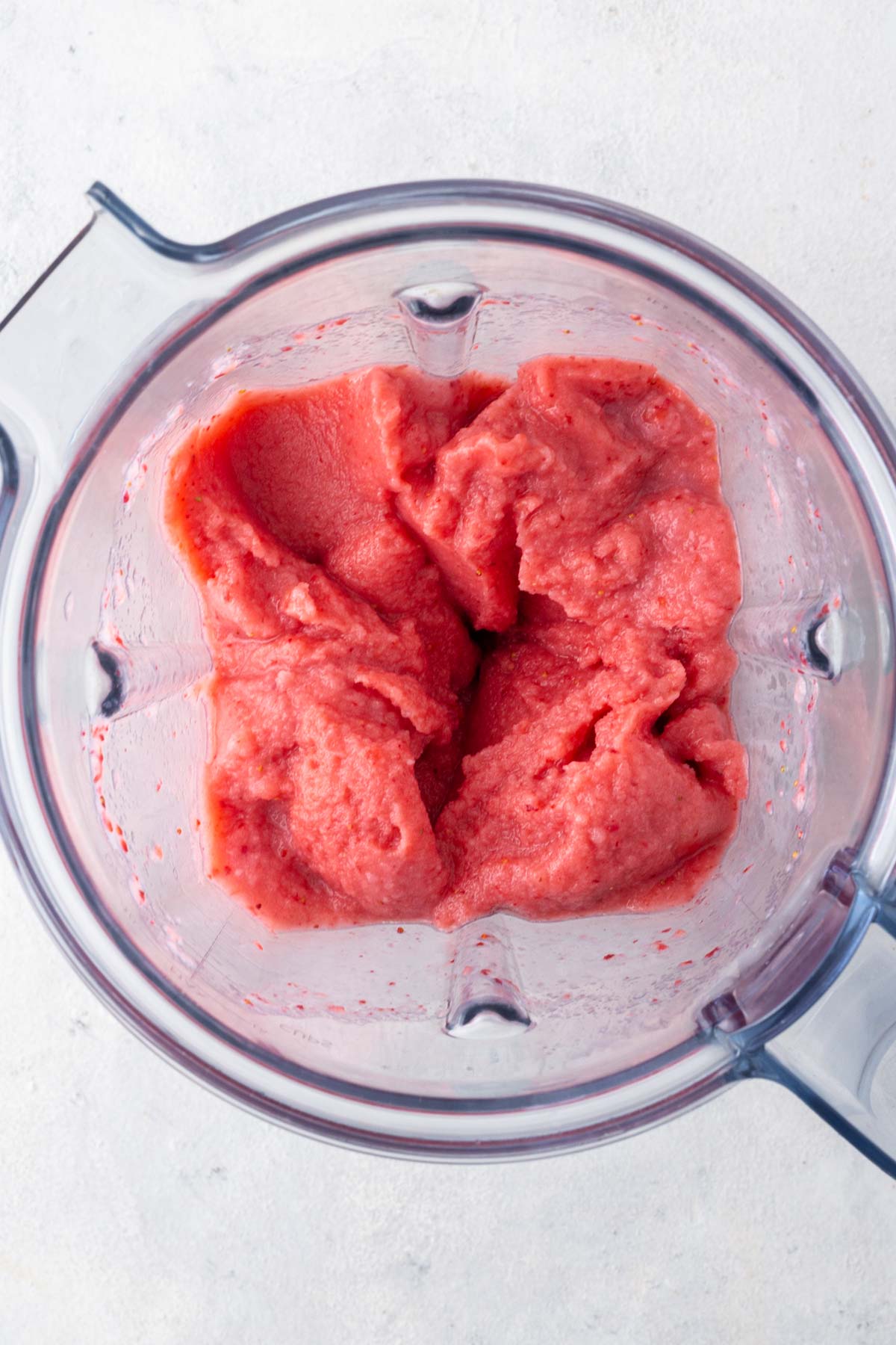 Strawberry smoothie bowl in a blender.