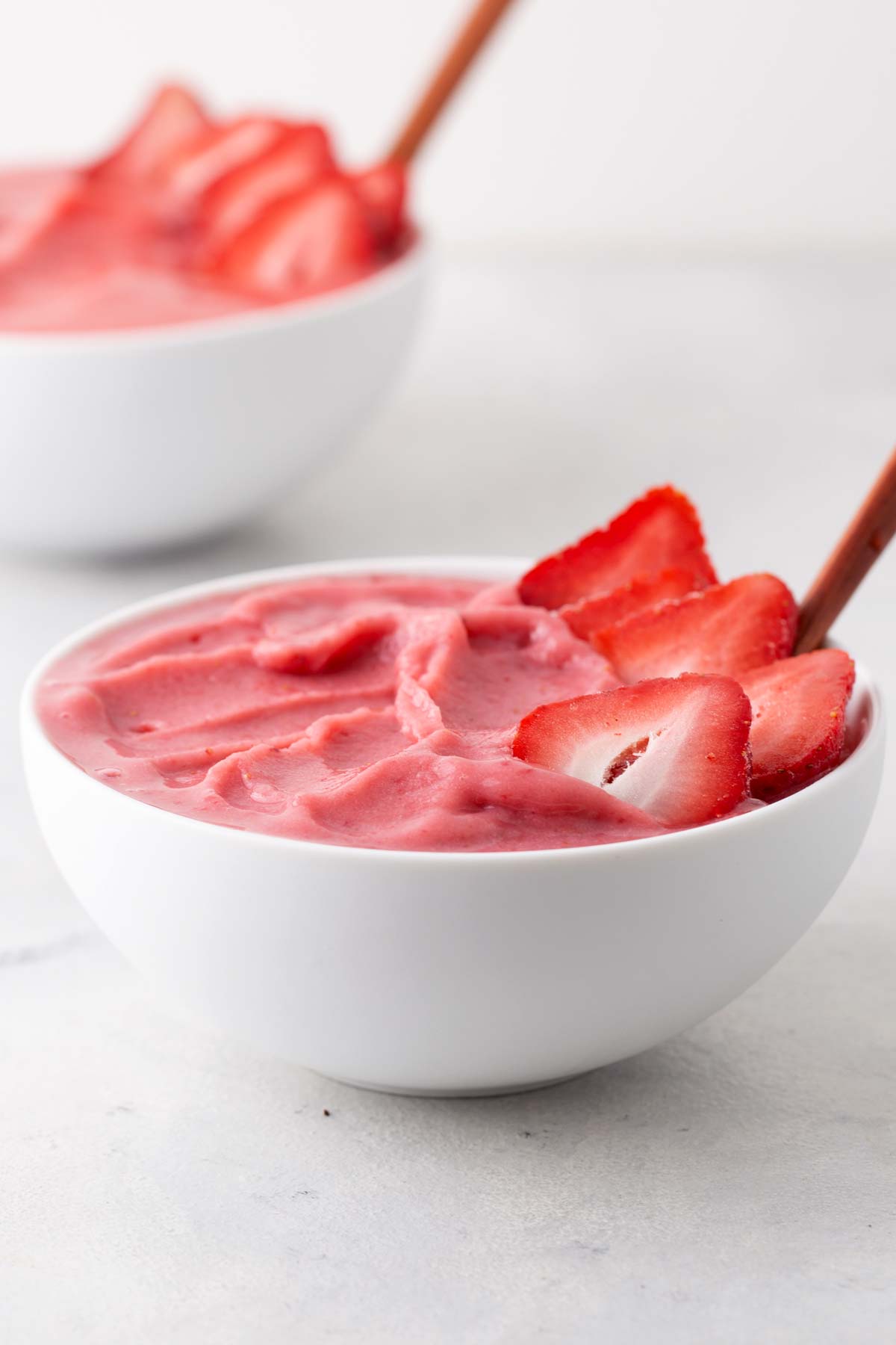 Strawberry smoothie bowl on a table.