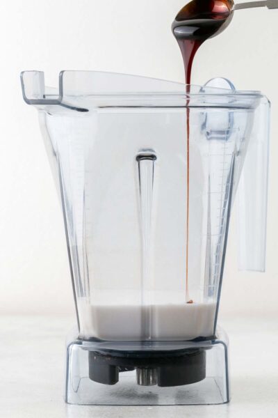 Date syrup and coconut milk in a blender. 